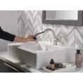 spotshield-brushed-nickel-delta-single-hole-bathroom-faucets-15840lf-sppd-e1_1000